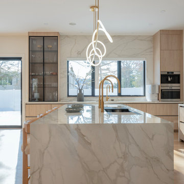 Sculptural Serenity: Dual-Faucet Marble Kitchen in Newton