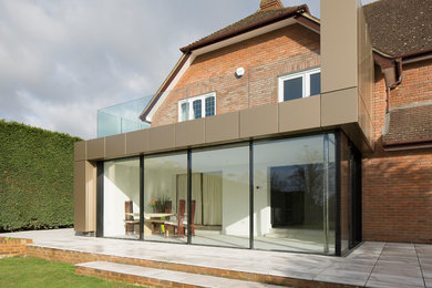 This is an example of a mid-sized contemporary exterior in Surrey.