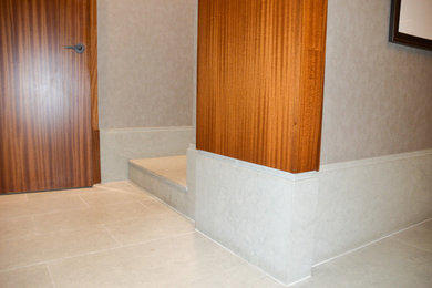 Example of a large minimalist entry hall design in New York