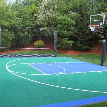Custom backyard Basketball Court with rebounder in Andover