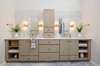 Inspiration for a large transitional master gray tile and ceramic tile ceramic tile, gray floor, double-sink and vaulted ceiling bathroom remodel in Other with flat-panel cabinets, beige cabinets, a two-piece toilet, beige walls, an undermount sink, quartz countertops, a hinged shower door, white countertops and a built-in vanity
