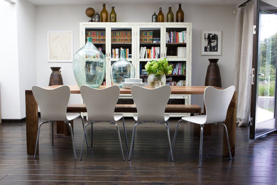 Example of a mid-sized eclectic dark wood floor great room design in Los Angeles with white walls