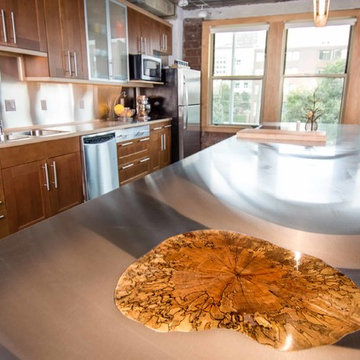Downtown Loft Transformation Unites Industrial and Organic Elements