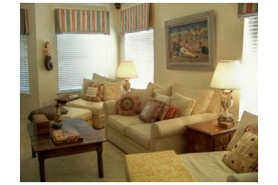 Example of a mid-sized beach style enclosed carpeted living room design in New Orleans with yellow walls, no fireplace and a wall-mounted tv