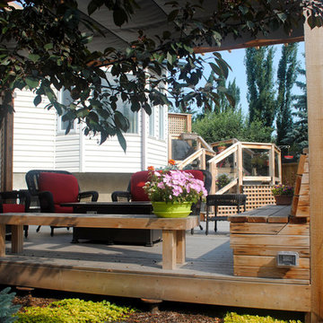 multi-level cedar deck with pergola, screening, built-in seating with storage an