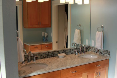 Inspiration for a large transitional master beige tile, multicolored tile and glass tile porcelain tile bathroom remodel in Portland with shaker cabinets, medium tone wood cabinets, a two-piece toilet, an undermount sink and blue walls
