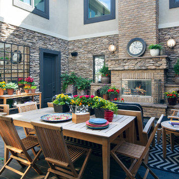 Transitional Stone Patio with Wood Outdoor Furniture