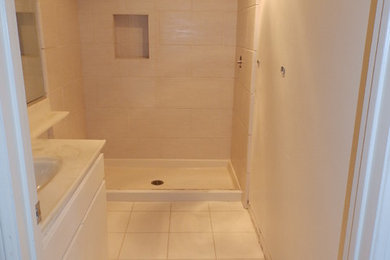 Example of a small trendy 3/4 beige tile and porcelain tile porcelain tile alcove shower design in Los Angeles
