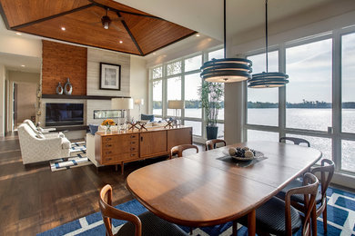 Example of a mid-sized transitional dark wood floor great room design in Grand Rapids with beige walls and no fireplace