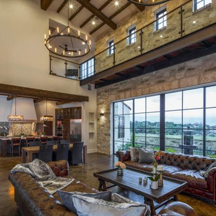 Large mediterranean formal open plan living room in Austin with white walls, concrete flooring, no fireplace, no tv and brown floors.