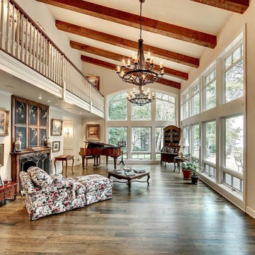 Antique Ash Flooring and Beams in an Elegant Two Story Living Room