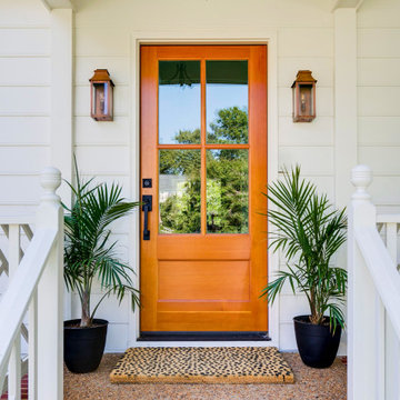 Warm Wood Entry Door with Symmetrical Porch Accents