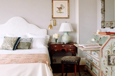 Photo of a large traditional master bedroom in New York with grey walls, dark hardwood floors and no fireplace.