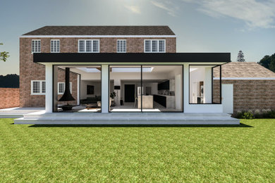 オックスフォードシャーにある高級なコンテンポラリースタイルのおしゃれな家の外観 (ガラスサイディング) の写真