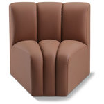Meridian Furniture - Arc Upholstered Modular Component, Cognac, 1-Piece: Curved Corner, Vegan Leather - Unleash modern opulence with the Arc Vegan Leather Curved Corner. Crafted for the modern connoisseur, this chair injects an air of refined luxury into any space. Its sleek silhouette, upholstered in supple cognac vegan leather, exudes timeless sophistication while the deep channel tufting adds textural intrigue, further elevating the chair's visual appeal. The modular design makes it a versatile chameleon, effortlessly adapting to your evolving needs and preferences. Whether you envision it gracing a chic living room corner, basking in the glow of a bedroom window, or adding a touch of drama to a home office, the Arc seamlessly complements your unique interior aesthetic.