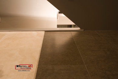 Inspiration for a transitional travertine floor hallway remodel in Calgary