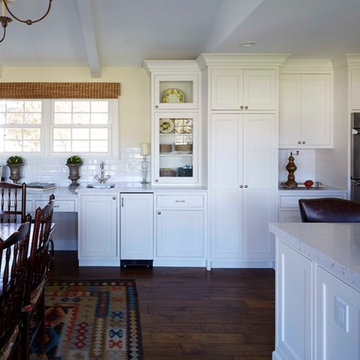 This kitchen area features a wet bar and a workspace