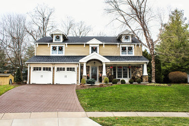 Mid-sized craftsman beige two-story vinyl gable roof idea in Philadelphia