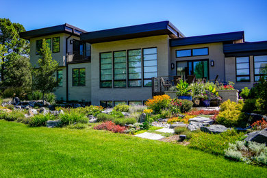 This is an example of a large mid-century modern landscaping in Denver.