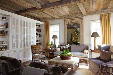 Example of a classic dark wood floor living room design in Birmingham with white walls and a concealed tv