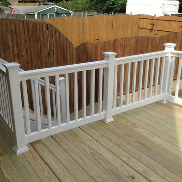 Small 12x12 Deck with walkway above basement stairs.