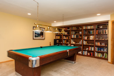 Inspiration for a mid-sized timeless look-out carpeted basement remodel in DC Metro with beige walls