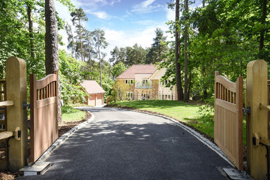 This is an example of an expansive contemporary front full sun garden in Surrey.