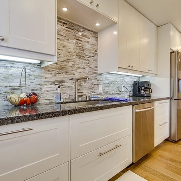 Kitchen on sink side facing entry.