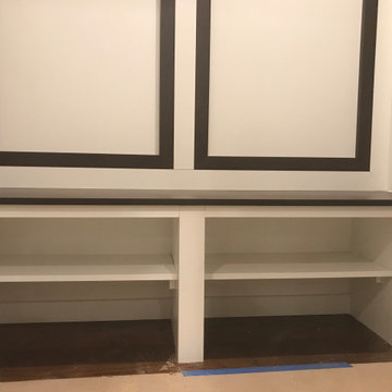 Custom white mudroom design shelf compartment