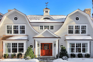 Large farmhouse white two-story wood house exterior idea in New York with a gambrel roof and a shingle roof