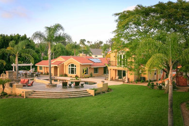 Inspiration for a large timeless backyard concrete paver patio remodel in San Diego
