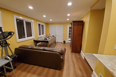 Elegant boy vinyl floor and brown floor childrens' room photo in Charlotte with yellow walls