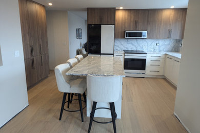 Inspiration for a coastal u-shaped vinyl floor kitchen remodel in Other with an undermount sink, flat-panel cabinets, dark wood cabinets, quartz countertops, gray backsplash, quartz backsplash, white appliances, an island and gray countertops