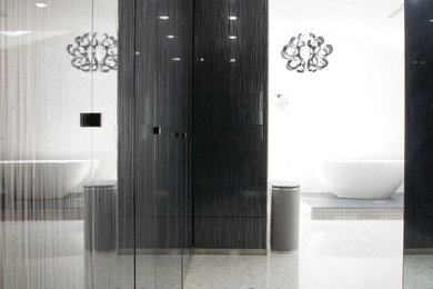 Photo of a large contemporary bathroom in Miami with flat-panel cabinets and white cabinets.