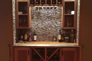 Example of an arts and crafts home bar design in Ottawa