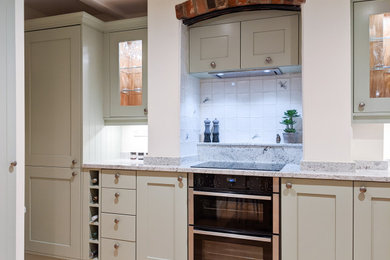 This is an example of a contemporary kitchen in Hampshire.