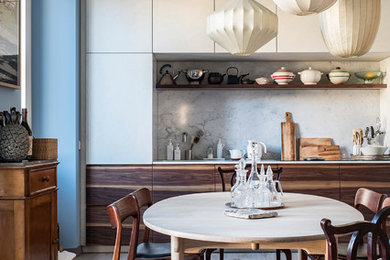Mid-sized scandinavian single-wall kitchen in Milan with flat-panel cabinets and no island.
