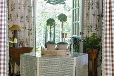 Example of a small classic carpeted and wallpaper foyer design in Atlanta with a green front door