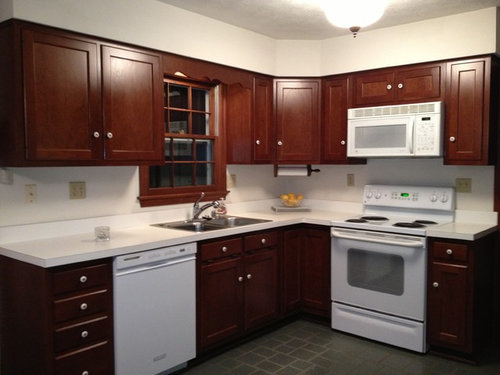 Brown Cabinets White Corian Countertop W White Appliances