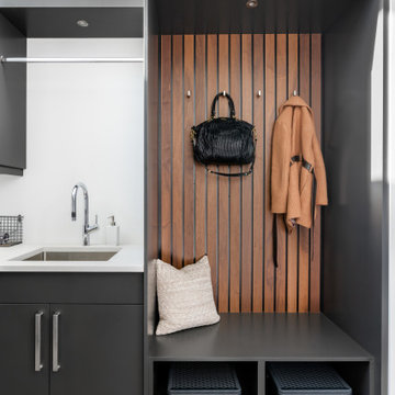 Contemporary Laundry Room with Custom Built Cabinetry and Wood Slates