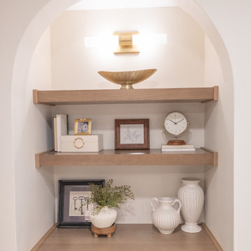 Warm & Inviting Basement Retreat with Custom Bar + Entertainment Center