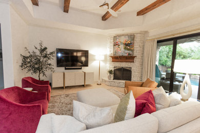 Large transitional open concept porcelain tile, beige floor and exposed beam living room photo in Dallas with white walls and a wall-mounted tv
