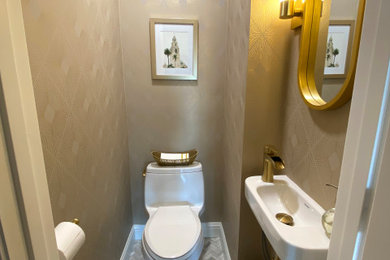 Powder room - small transitional mosaic tile floor, multicolored floor and wallpaper powder room idea in San Francisco with white cabinets and a wall-mount sink