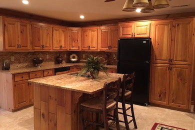 Open concept kitchen - large traditional l-shaped ceramic tile and beige floor open concept kitchen idea in Other with an undermount sink, raised-panel cabinets, medium tone wood cabinets, granite countertops, brown backsplash, black appliances and an island