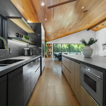 Sink Run with Brass Faucet Under a Garden Window