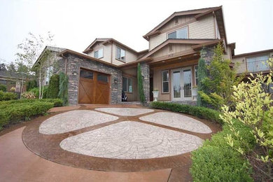 Example of a large classic beige two-story exterior home design in Seattle
