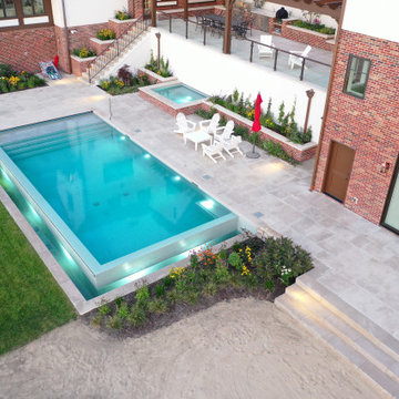 Lakeside Retreat with this Exquisite and Sophisticated Pool & Spa Oasis