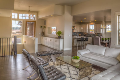 Large trendy formal and open concept dark wood floor and brown floor living room photo in Other with beige walls, a standard fireplace and a stone fireplace