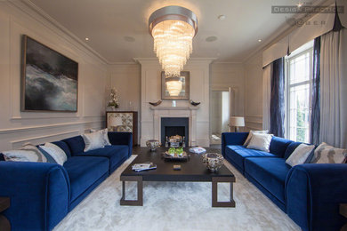 Design ideas for a contemporary living room in Manchester with dark hardwood flooring.