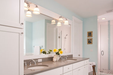 Design ideas for a mid-sized traditional master bathroom in Seattle with an undermount sink, shaker cabinets, white cabinets, engineered quartz benchtops, a claw-foot tub, a two-piece toilet, white tile, porcelain tile, blue walls and porcelain floors.